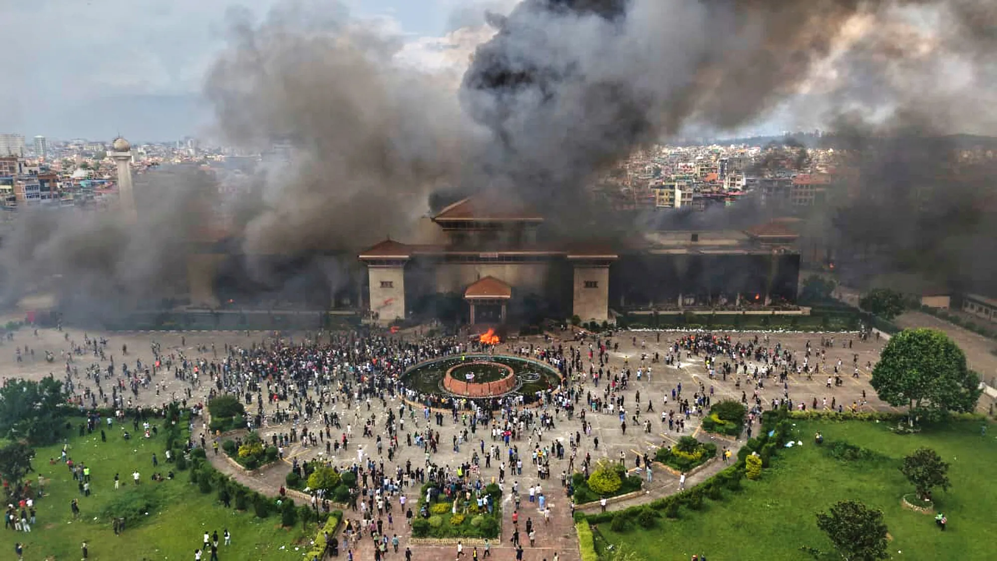 Smoke rising from Nepal's Federal Parliament during civil unrest in Kathmandu